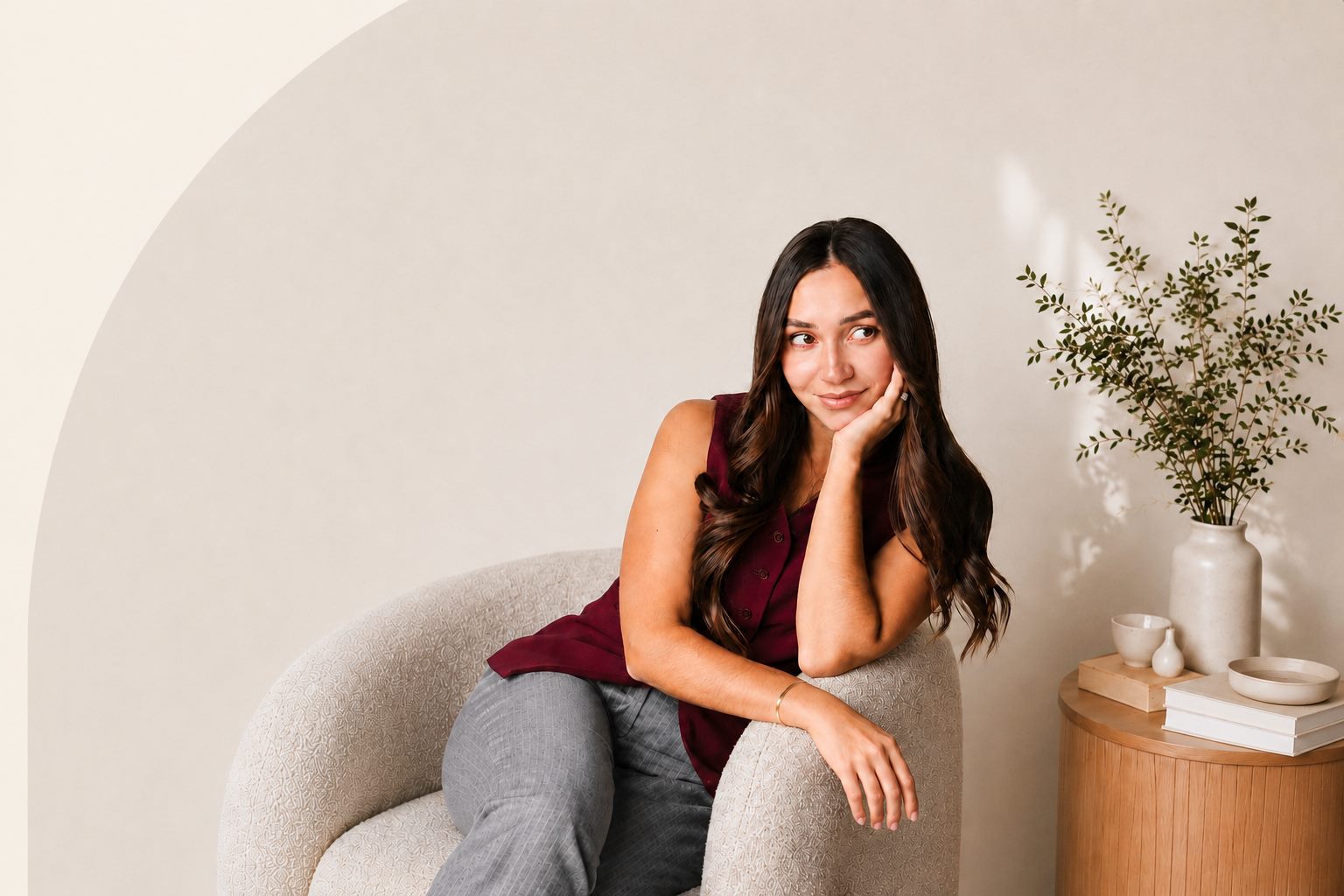 Elena, BC mortgage broker, seated and smiling